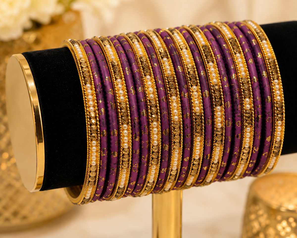 (B16) Elegant purple and gold bangle set featuring delicate gold detailing, sparkling stonework and pearl accents. A beautiful statement set, perfect for weddings, Eid, parties and special occasions size 2.4