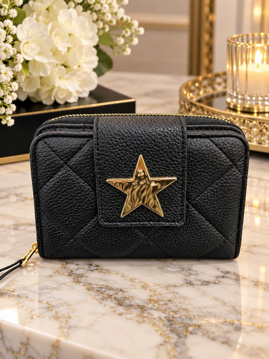 (353) Elegant black quilted purse featuring a statement gold star detail and matching gold ziip Stylish, compact and perfect for everyday use