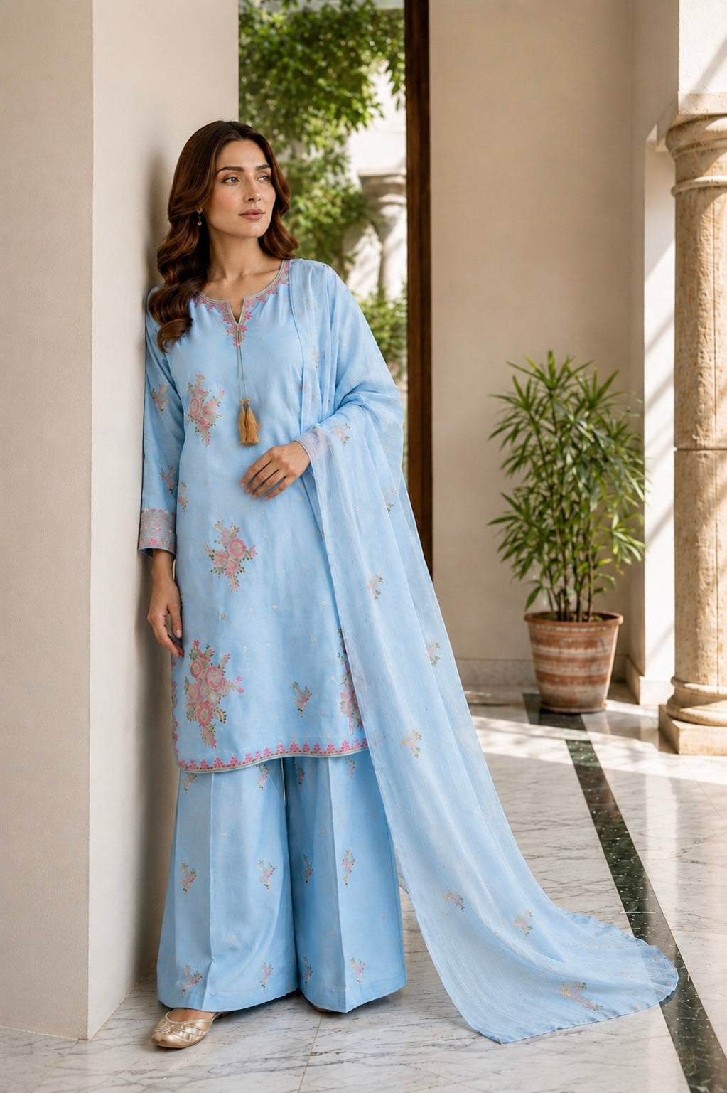 (355) Abeeha Elegant Light blue Viscose Suit – A beautifully designed rounded kameez featuring delicate gold thread floral embroidery, paired with stylish palazzo trousers and a soft bamber dupatta.