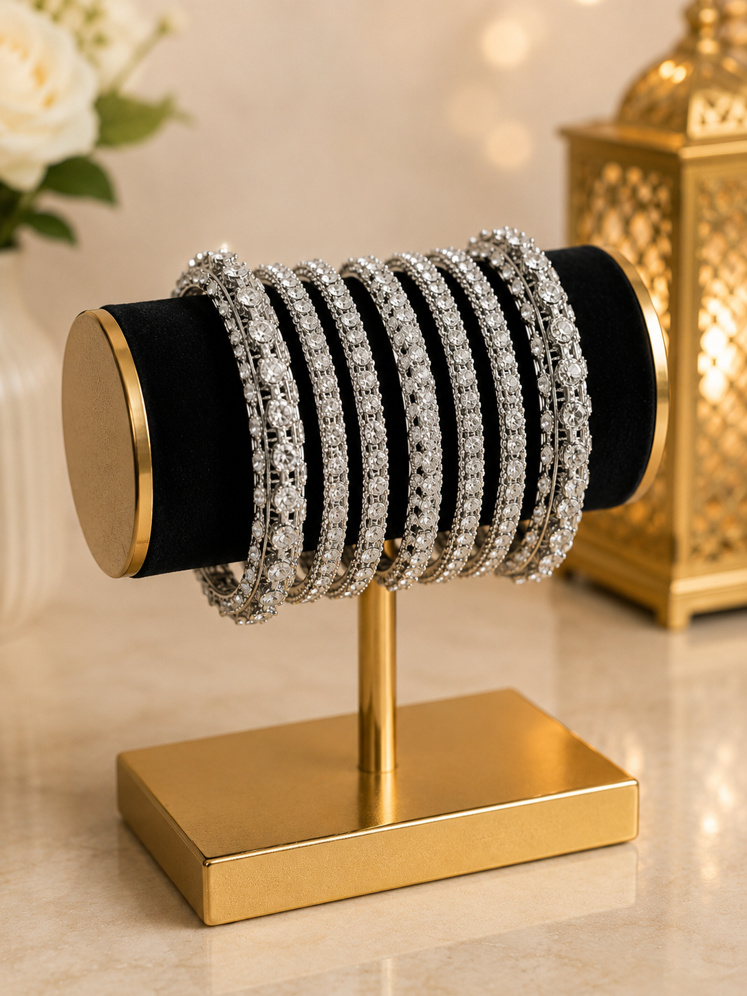 (B25) A stunning silver-tone bangle set beautifully embellished with sparkling diamanté stones. Featuring a mix of delicate and statement designs for an elegant, luxurious finish. Size 2.8