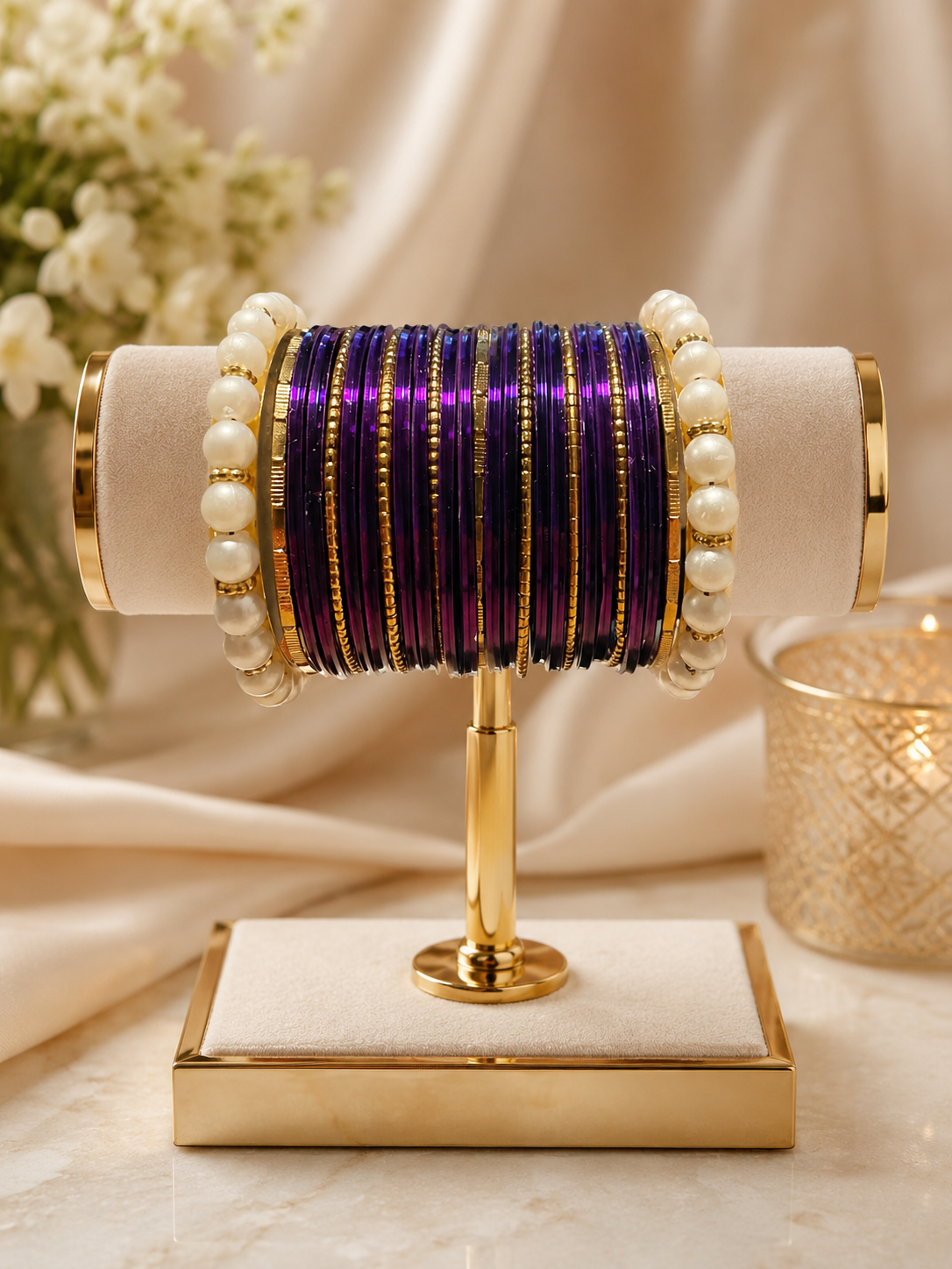 (B7) Elegant purple and gold bangle set featuring shimmering metallic bangles, delicate gold detailing and beautiful pearl accents. A timeless statement set size 2.4