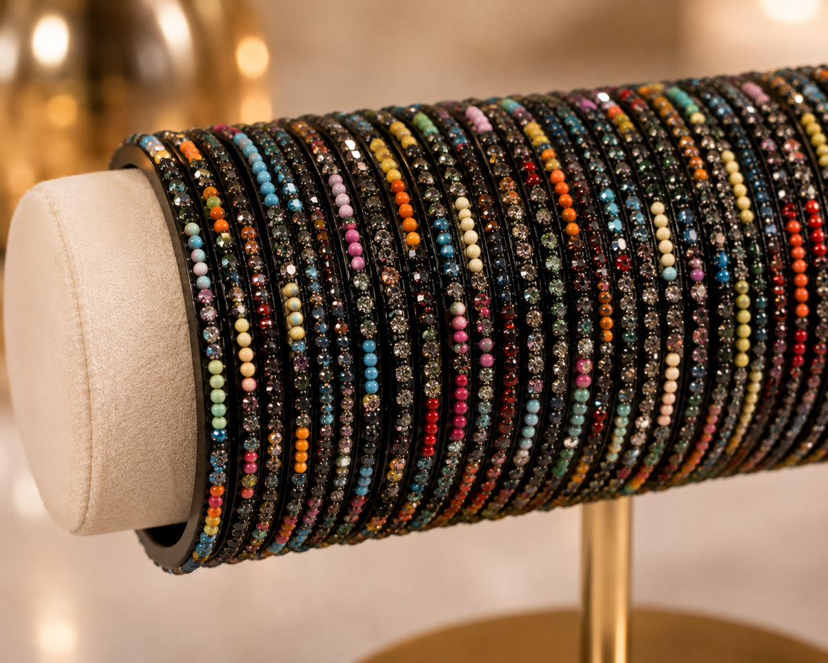 (B13) Elegant multicoloured bangle set featuring delicate beaded detailing and sparkling diamanté accents on a sleek black base perfect for adding colour and sparkle to everyday looks