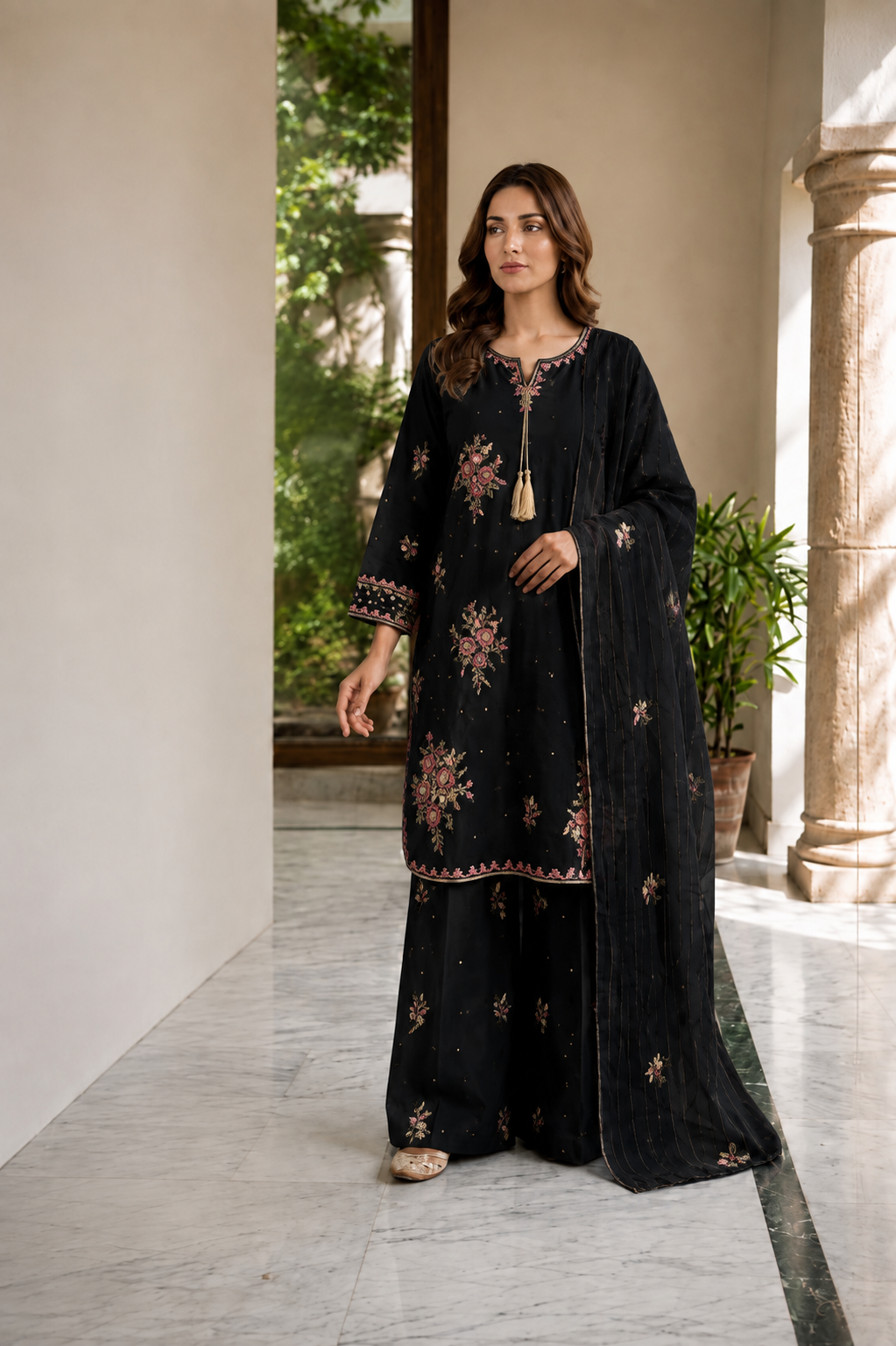 (354) Abeeha Elegant black Viscose Suit – A beautifully designed rounded kameez featuring delicate gold thread floral embroidery, paired with stylish palazzo trousers and a soft bamber dupatta