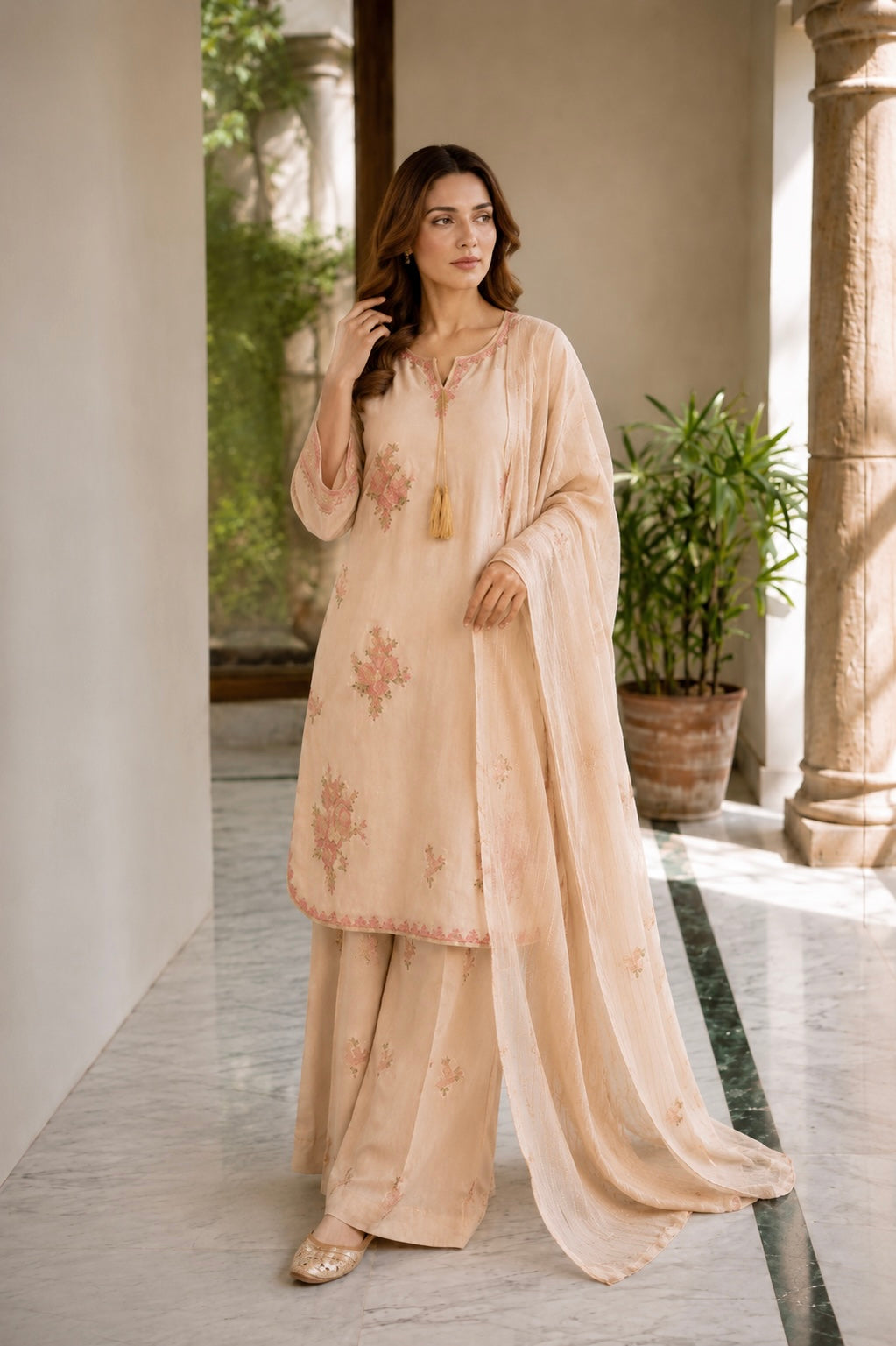 (366) Abeeha Elegant beige Viscose Suit – A beautifully designed rounded kameez featuring delicate gold thread floral embroidery, paired with stylish palazzo trousers and a soft bamber dupatta.