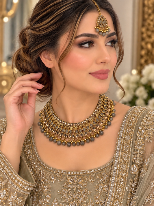 (J11) antique gold jewellery set featuring grey stones, sparkling crystal detailing and delicate bead drops, complete with a statement necklace and matching tikka