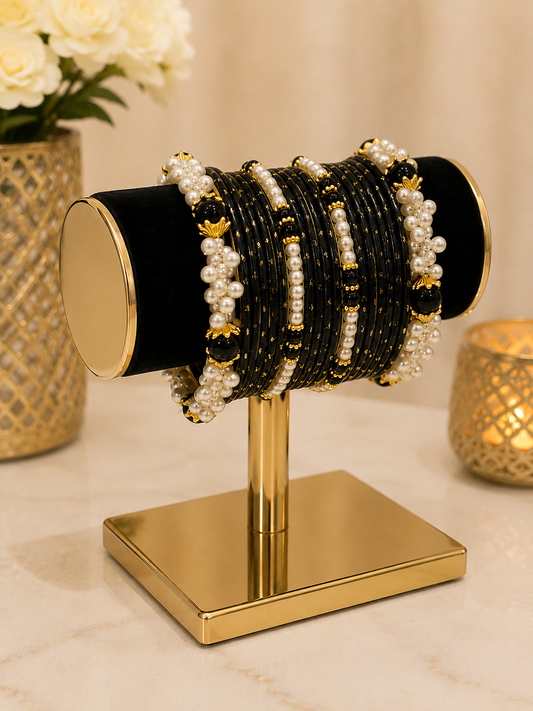 (B17) Elegant black and gold bangle set featuring delicate gold detailing, glossy black beads and beautiful pearl clusters. A striking traditional design size 2.4