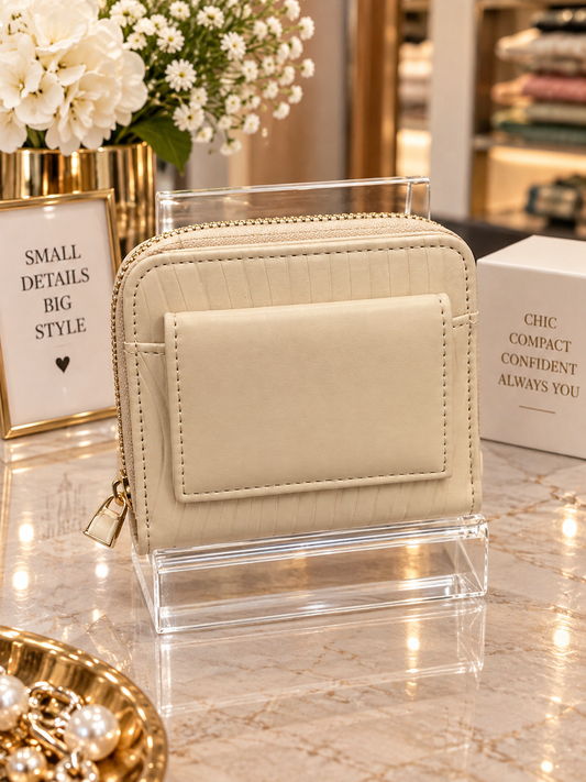 (365) Elegant cream compact purse with a chic textured finish, gold zip detailing and multiple card slots. Stylish, practical and perfect for keeping everyday essentials organised