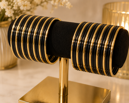 (B23) A stunning set of beautifully detailed gold-tone bangles, designed to add sparkle and elegance to any outfit. Size 2.8