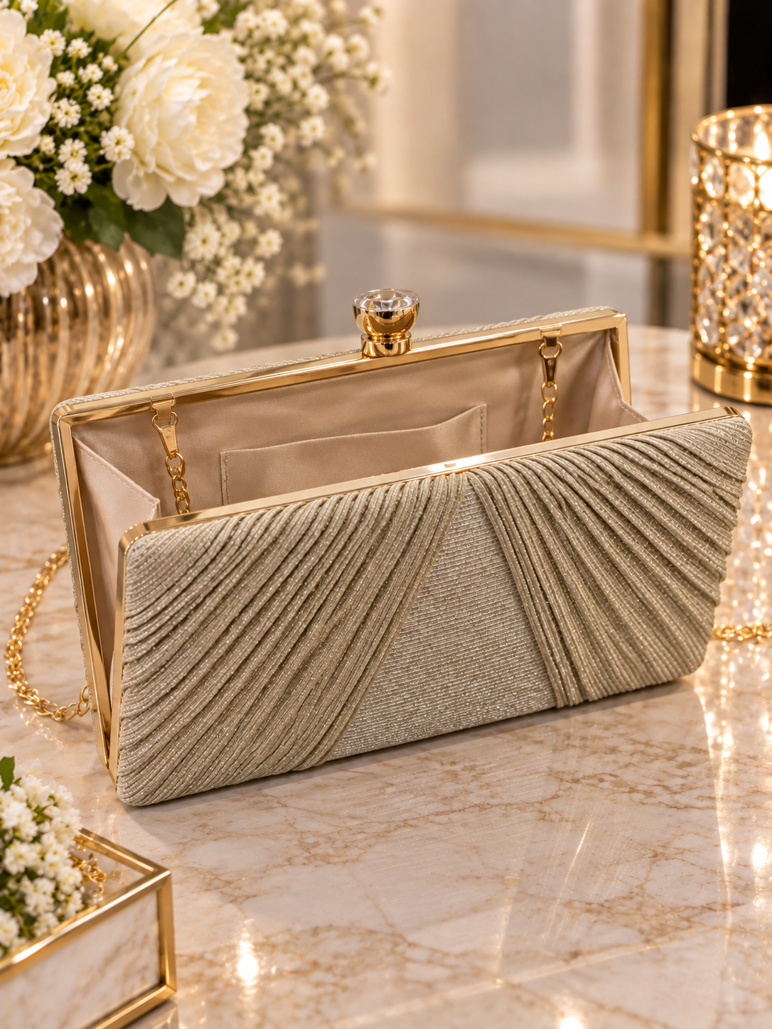 (33) Elegant champagne gold clutch bag featuring a stunning pleated shimmer design, sparkling finish and chic gold clasp